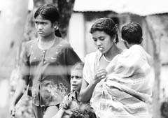Villagers flee from their homes near the armys multi-barrel rocket firing positions aimed at Tamil Tiger rebels in Trincomalee, northeastern Sri Lanka