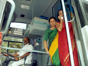 Passengers use a mobile PCO in a tourist bus at Hubli on Thursday. The service has been introduced for the first time in Karnataka by Reliance.