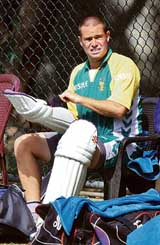 South Africas Andrew Hall puts on his pads during a practice session at the R. Premadasa Stadium in Colombo on Thursday