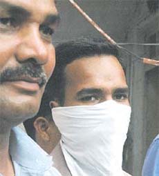 The accused in police custody.