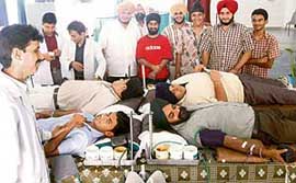 Volunteers donate blood at a camp organised by I-Care, a school students group, at Ajit Karam Singh International Public School, Sector 41, Chandigarh, on Sunday.