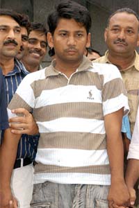 Sanjay Babu, accused in the killing of seven members of a family at Inderlok, in custody of the police in New Delhi