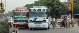 Private bus drivers block the entire road in total disregard of all traffic rules at Phagwara