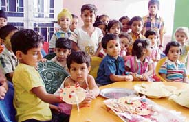 Students of Kiddies Paradise Playway School make rakhis