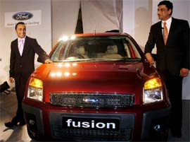 Bollywood actor Rahul Bose and Mr Arvind Mathew, Managing Director and President of Ford India, pose for photographers at the launch of new Ford Fusion car in New Delhi on Wednesday.