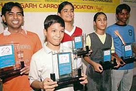 Winners are all smiles after receiving their trophies at the 16th Chandigarh State Carrom Tournament at St Stephens School, Sector 45, Chandigarh