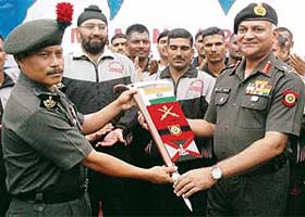The GOC-in-C, Western Command, Lieut-Gen Daljeet Singh, hands over the expedition flag to Lieut-Col I.S. Thapa, team leader of Maratha Light Infantry mountaineering expedition, during its flag-off ceremony in Chandimandir