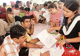 Candidates seeking admission in B.Ed colleges fill in forms during counselling at Panjab University, Chandigarh