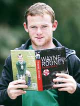 England football star Wayne Rooney poses with his book My story so far in Manchester on Thursday