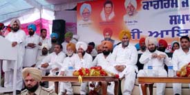 Mr Shamsher Singh Dullo president, PPCC, addresses a mass contact conference at Hambran in the Dakha constituency in Ludhiana on Friday. Mr Lal Singh Minister for Rural Development and Panchayats, Food and Supply Punjab, and Mr Malkiat Singh Dakha, MLA, are also seen in the picture