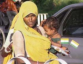 A woman sells flags for Independence Day at Phase -7