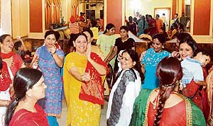 Ladies at the NGOs Wife Club celebrate Teej in Ludhiana on Saturday.