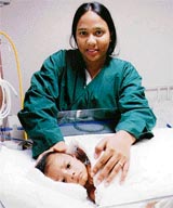 I am the happiest mother in the world, says Razia Begum from Bangladesh as she nurses her three-month-old boy in Delhi after a rare successful operation for a congenital heart defect