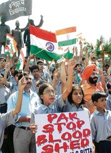 All-India Anti-Terrorism Front president M.S. Bitta and schoolchildren take an oath to fight terrorism on the occasion of International Youth Day, in New Delhi on Saturday