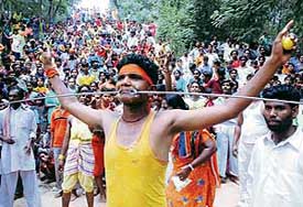 Devotees take part in a Sheetla Mata pooja procession at Sukhna Lake in Chandigarh on Sunday