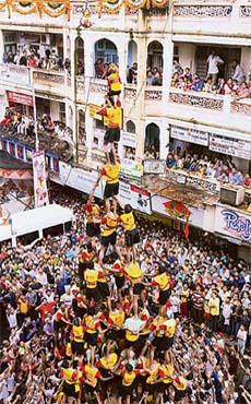 Men form a human pyramid during a dahi handi contest in Mumbai on Wednesday on the occasion of Janmashtami