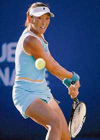 Ai Sugiyama of Japan returns a shot to Aleksandra Wozniak of Canada