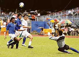 Al Qahtani Yasser (in white) of Saudi Arabia eyes the ball during the AFC Asian Cup qualifier match against India in Kolkata on Wednesday. Saudi Arabia won the match 3-0. 