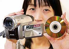 Japan's electronics giant Matsushita Electric employee displays a new 3CCD DVD camcorder with a high magnifying power zoom lens, "DVD digicam VDR-D400", equipped with three 800,000-pixel CCDs on an image sensor with image stabilising system, enabling it to record 120 minutes of digital video images on an 8 cm diameter DVD disk, at the company's showroom in Tokyo on Friday. The company will put it on sale from September 1 at an estimated price of 1,20,000 yen ($1,040).