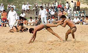 A wrestling match in progress at Dadu Majra village.