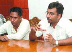 AIDS patient Baljinder Singh (left), along with his doctor, at a press conference in Jalandhar on Friday.