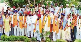 Members of backward class with the acting president of the Lok Bhalai Party, Mr Avtar Singh Mulapuri, in Ludhiana on Friday. 