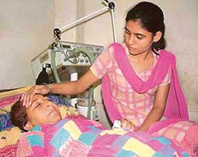 Ms Dalbir Kaur, sister of Sarbjit Singh, is taken care of by Swapandeep Kaur, Sarbjit Singhs daughter, at a Bhikhiwind hospital.