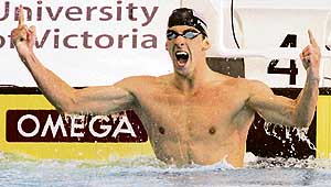 Michael Phelps of the USA celebrates after setting a world record in the mens 200m butterfly during the Pan Pacific swimming championships in Victoria, Canada, on Thursday.   Reuters