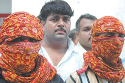 The snatchers in police custody.
