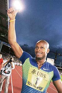 Jamaicas Asafa Powell celebrates after winning the mens 100m sprint at the IAAF Golden League meet in Zurich