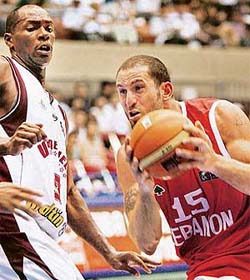 Lebanons Fadi El Khatib gets past Venezuelas Oscar Torres during their opening game at the World Basketball Championships in Sendai, Japan