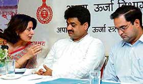 The Director, Department of Renewable Energy, Ms Sumita Mishra, has a word with the Deputy Chief Minister, Mr Chander Mohan, at a function held to mark Akshay Urja Divas at Red Bishop in Panchkula on Sunday. 