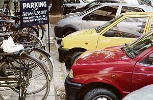 The wrongly parked cars at a parking lot located on a road in front of the Mehfil restaurant in Sector 17 in Chandigarh.