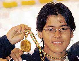 Indias Fariah Zaman shows the gold medal won by her in the womens 100m backstroke at the South Asian Games in Colombo on Sunday
