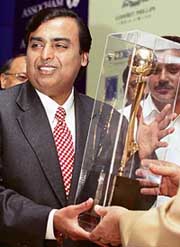 Reliance Industries Ltd Chairman Mukesh Ambani receives the outstanding corporate leader award for 2006 at a conference on partnership between business and law in New Delhi on Monday. 