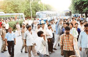 Commuters stranded on Madhya Marg after Haryana Roadways employees blocked the road following a dispute with the Chandigarh Traffic Police on Monday.
