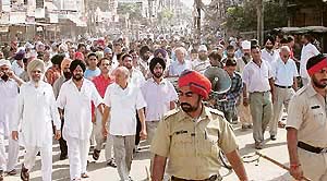 The Traders Association holds a protest march against poor power supply in Doraha on Monday.