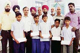 Five poor students of Government Multipurpose Senior Secondary School were adopted by the Hari Singh Nanda Memorial Foundation at a function held on the school campus in Ludhiana on Monday.