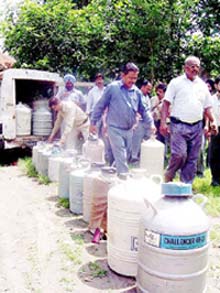 Veterinary pharmacists return the vaccination and artificial insemination kits at Pathankot on Monday.  Photo by J