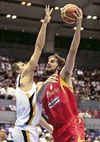 Germanys Dirk Nowitzki (left) tries to stop Spains Pau Gasol during their first-round match at the World Basketball Championship in Hiroshima on Monday. Spain won 92-71. 