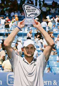 Andy Roddick of the USA lifts the trophy after defeating Spains Juan Carlos Ferrero 6-3, 6-4 in the final of the Cincinnati Masters tennis tournament in Mason, Ohio, on Sunday. 