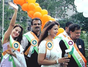 Bollywood stars Amisha Patel and Poonam Dhillon take part in the 59th Indian Day Parade in New York on Sunday.