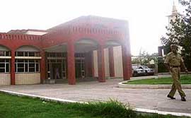 A policeman comes out of a community centre at Phase-V, Mohali, on Wednesday. Besides this community centre there are three other where policemen have been lodged.