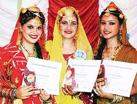 Miss Teej Daizy (centre) flanked by the first and the second runners-up at a function at Arya College in Ludhiana on Wednesday.