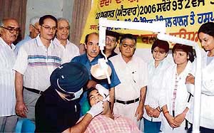 Patients being examined at a dental check-up camp organised by the Lions Club, Ludhiana, on Tuesday.