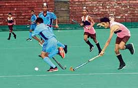 The hockey match between GTB Academy, Baba Bakala, and Surjit Academy, Jalandhar, in progress at Sector 42, Chandigarh, on Thursday. 