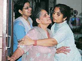 Mother of Vivek Gupta being consoled by relatives in Mohali on Thursday. 