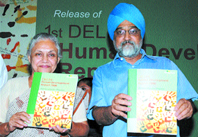 Planning Commission Deputy Chairman Montek Singh Ahluwalia along with Chief Minister Sheila Dikshit releasing the Human Development Report at Delhi Sachivalaya in the Capital on Thursday.