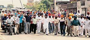 Members of various organisations take part in a rally in Ludhiana on Thursday in protest against the cutting of hair of a Sikh youth in Jaipur.