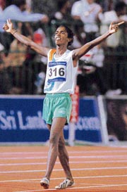 Indias S.Shanti celebrates on winning the womens 1500m gold medal at the South Asian Games in Colombo on Thursday. 